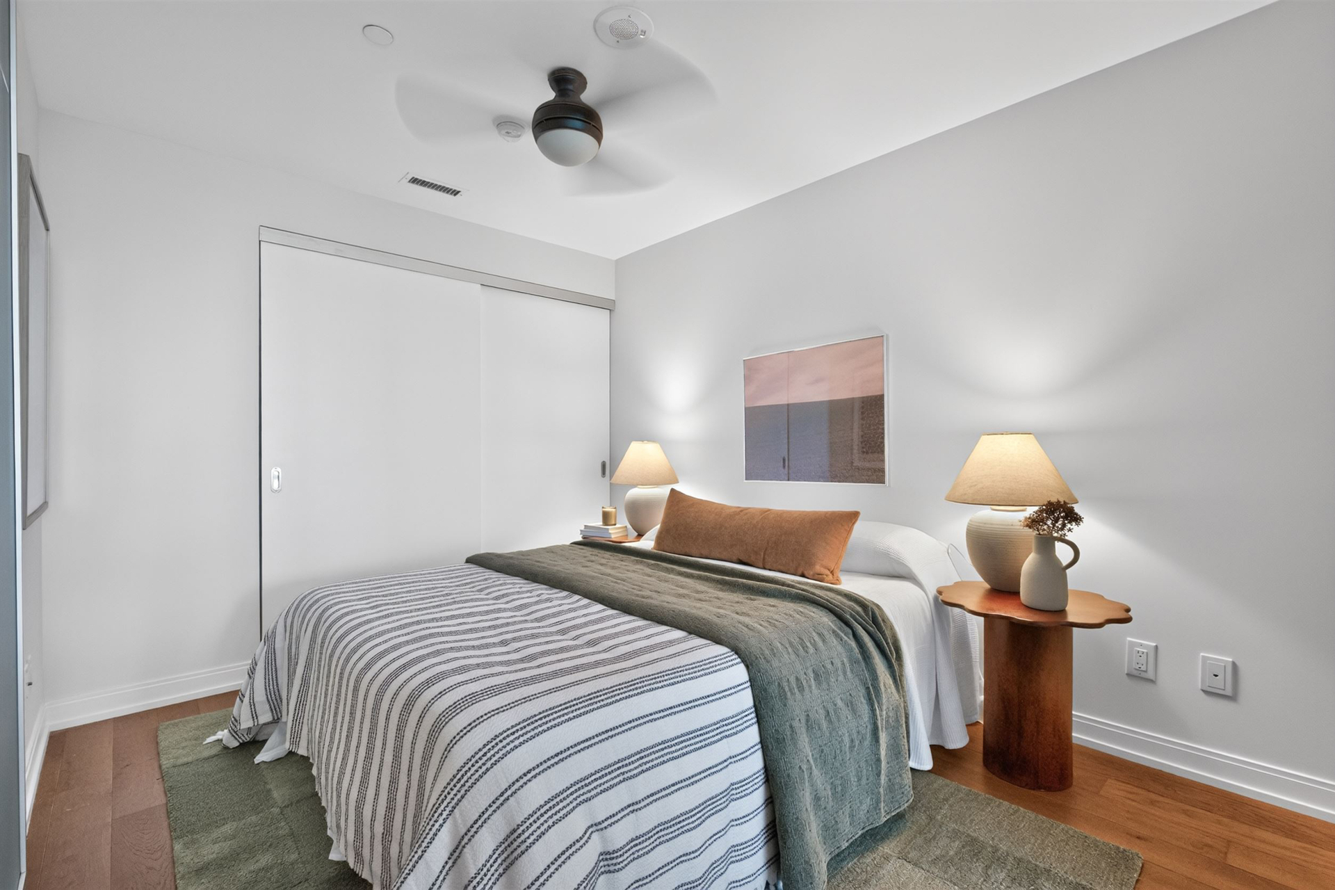 Second bedroom with warm neutral styling