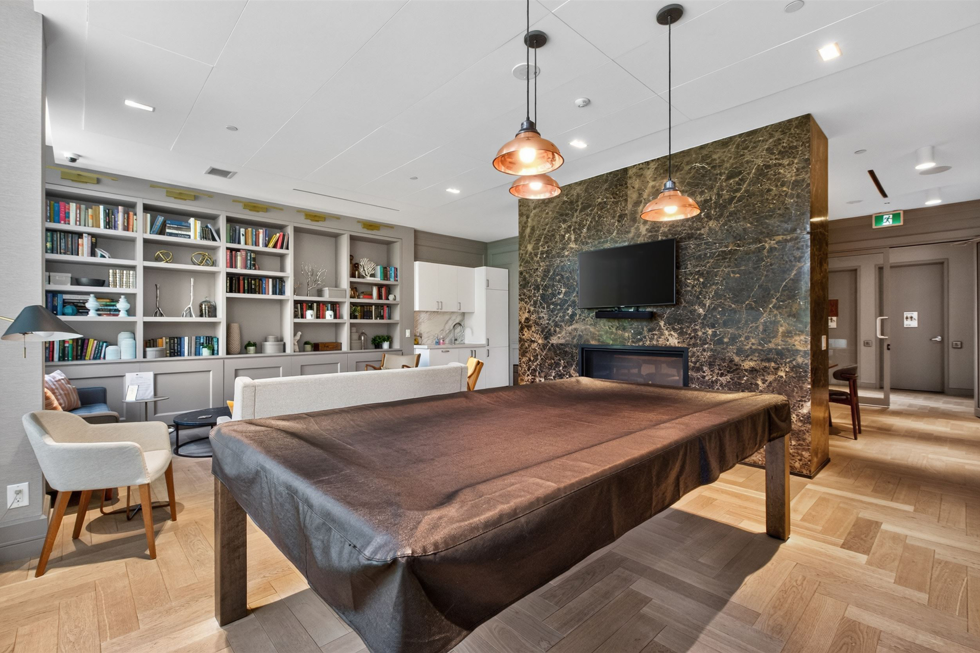Party room lounge with marble fireplace and kitchenette
